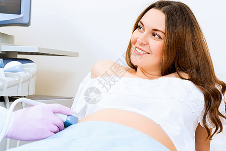 接受医生诊治的怀孕妇女考试婴儿待产夫妻测量卫生女士女性病人检查图片