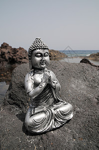 佛像雕像热带宗教塑像雕塑沉思石头岩石假期寺庙太阳图片