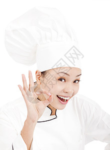 美貌女性厨师面包师或厨师展示好手牌图片