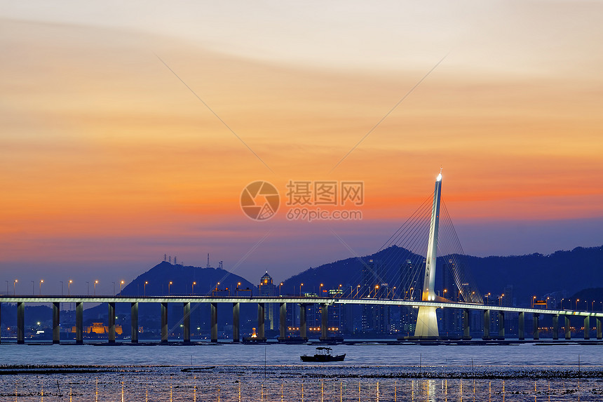 日出过长桥天际海洋码头天空晴天城市阳光旅游橙子地平线图片