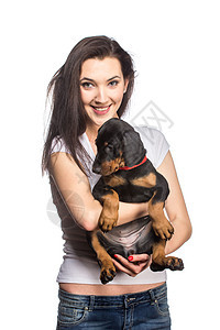 黑发女孩和她的小狗 在白色背景下被孤立女士伴侣工作室毛皮动物犬类幸福朋友宠物乐趣图片