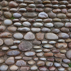 孔墙墙鹅卵石建造石头圆形正方形背景图片