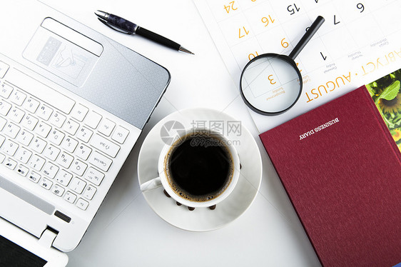 商务静物笔记本商业键盘放大镜数字日历桌面白色日记桌子图片