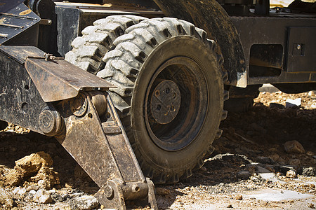 挖掘车轮车辆活动建筑土壤反铲刀刃搬运工拖拉机地面沙坑图片