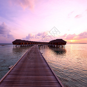 马尔代夫海滩日落海洋房子蓝色平台天空平房海岸线海景酒店海滩图片