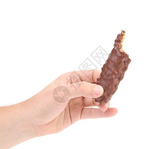 手握着黑巧克力棒坚果糖果甜点食物胡扯巧克力核桃小吃牛奶可可图片
