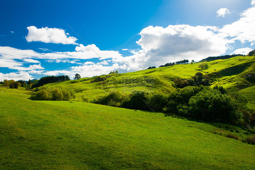 新西兰山丘牧场曲线天空日落蓝色山脉晴天国家滚动乡村图片