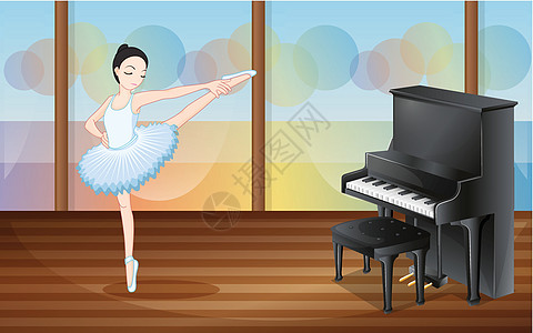 一个芭蕾舞者在工作室的钢琴旁边跳舞图片