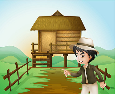 一个戴着帽子的男孩 站在尼帕小屋附近高清图片