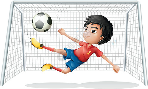 一个穿红色制服的男孩踢足球图片