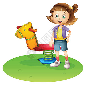 一个女孩站在马的弹簧玩具旁边图片