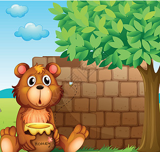 一只熊 在砖块附近有蜂蜜图片