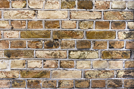 旧砖墙棕色风化材料建筑石头石墙图片