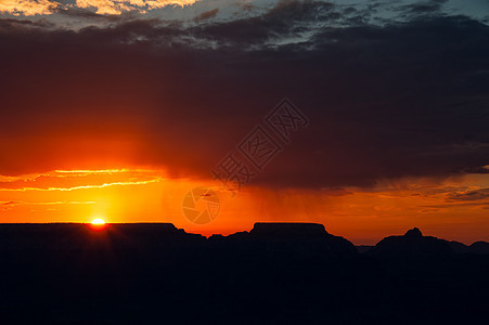 日落在大峡谷上橙子水平岩石场景地质学旅游摄影天空旅行太阳图片