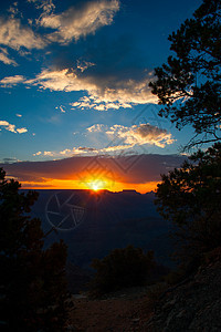 日落在大峡谷上目的地天空摄影旅游太阳橙子场景地质学岩石风景图片