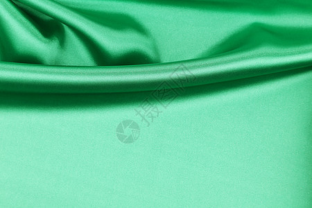 绿色的丝绸拉皮样本墙纸折叠丝带奢华微光热情织物版税海浪图片
