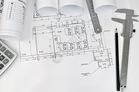 建筑师的绘画和工具卷统治者计算器线条铅笔卷轴草稿卡尺打印文档桌面图片