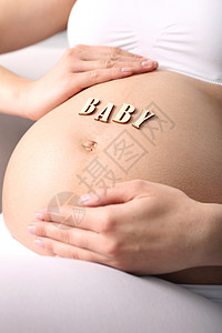 孕妇的肚子妈妈皮肤婴儿情怀卫生孩子胸部拥抱母亲女士图片