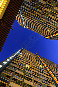 摩天大楼蓝色外观办公楼建筑学日落建筑城市玻璃阳光城市生活背景图片