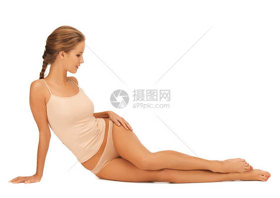 穿着棉内裤的妇女触摸腿部保健护理福利脱毛棉布内衣赤脚微笑女性卫生图片