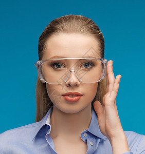戴保护眼镜的女商务人士商业女性安全齿轮技术人士成人青年配饰工人图片