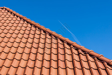 红瓦黏土橙子建筑陶瓷瓷砖平铺屋顶材料房子住宅背景图片