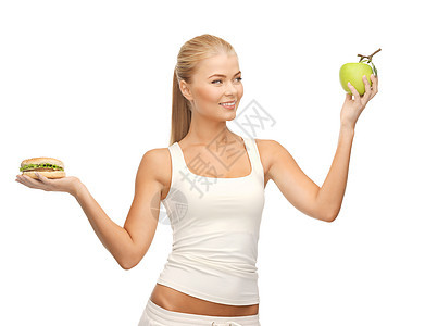配有苹果和汉堡包的妇女低脂肪减肥水果困境碳水女孩损失微笑数字维生素图片