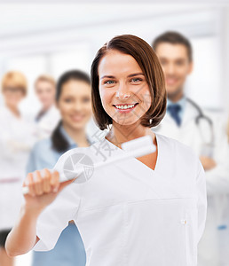 健齿美白有牙刷的牙医在医院治疗搪瓷假牙卫生诊所微笑刷子女士医生女性背景