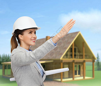 带着蓝图的白头戴白头盔的微笑建筑师经理房子项目老板工程师建筑女性方案建筑学成人图片