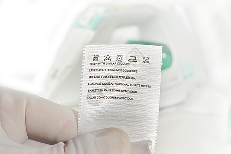洗衣咨询服装标签警告材料打扫纺织品宏观数据衣服熨烫指导白色图片