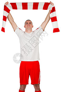 持条条围巾的足球运动员男人红色欢呼运动服男性播放器运动优胜者齿轮活动图片