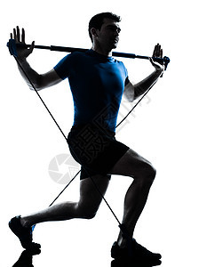 运动健身锻炼的男子 身高健康姿势健身房体操棒练习橡皮松紧带乐队背光运动装训练阻力图片