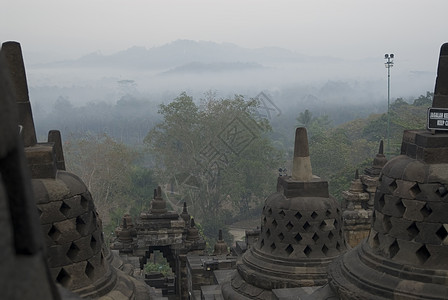 背包旅行波罗布杜尔独奏人心寺庙背包火环冒险佛教徒文明旅游瑜珈背景