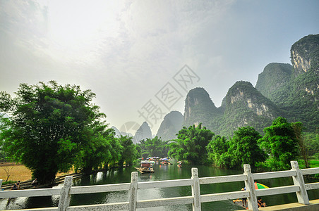 阳久桂林的李河山地貌旅行岩溶漂浮森林水路钓鱼岩石面纱农村天空图片