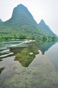 阳久桂林的李河山地貌面纱反射观光岩溶山脉竹子天空漂浮水路假期背景图片