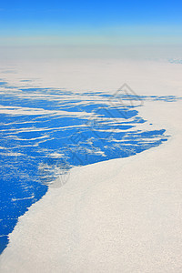 格陵兰的空中观察海岸冷冻蓝色峡湾流动冰川冰山天线图片