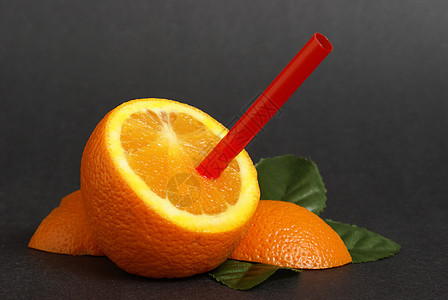 橙汁食物热带水果宏观果汁黑色红色养分圆形稻草图片