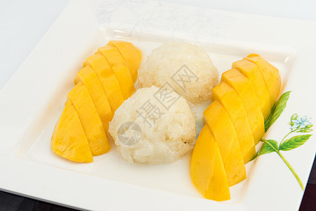 加鲜芒果的甜糊米面椰子牛奶奶油叶子食物热带营养美食午餐坚果水果甜点图片