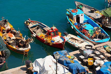 在意大利利古里亚港的渔船船支撑困惑汽艇港口蓝色运输码头绳索浮标渔网图片