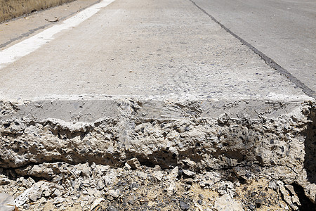 分层切割道路水泥挖掘机土壤碎石建造岩石工作地面维修裂缝背景图片