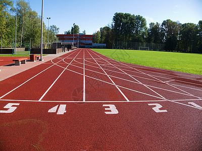 体育场的红色赛道车道短跑橡皮赛马场竞技场运动沥青网格赛跑者曲线图片