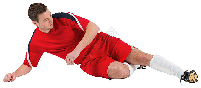 红脚踢足球运动员男性精神运动服球衣播放器红色白色活动男人齿轮背景图片