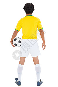 足球运动员在黄色握球中齿轮世界球衣运动服男人运动活动团队男性闲暇图片