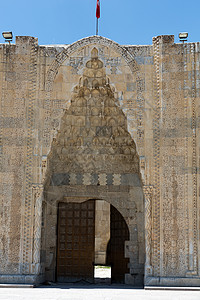 土耳其丝绸之路Sultanani大篷车入口处丝绸古董雕刻入口跳马天空火鸡石头门廊建筑图片