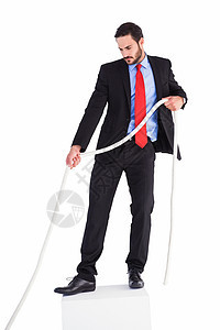 商务人士拼命拉绳子职业套装拔河比赛人士公司商务专注男性商业绳索图片