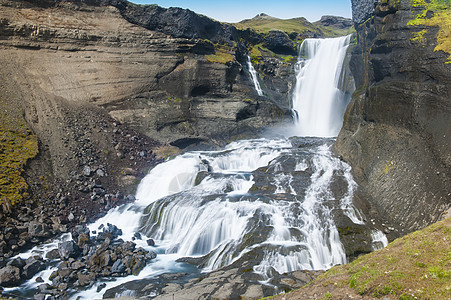 冰岛瀑布冰川溪流流动天蓝色石头岩石运动力量荒野海浪图片