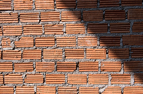 砖砖墙黑色水泥阴影红色材料建造棕色墙纸砖块建筑学图片