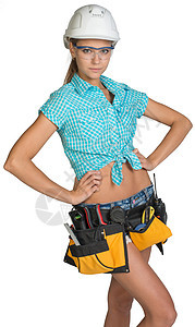 身戴硬帽 工具带和防护眼镜的妇女臀部牛仔裤蕾丝双手女性职业螺丝刀精神工作员工图片