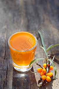 海角果汁和浆果衬套玻璃季节叶子鼠李植物宏观排毒沙棘水果图片