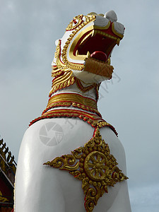 白狮王雕像狮子佛教徒寺庙白色信仰背景图片